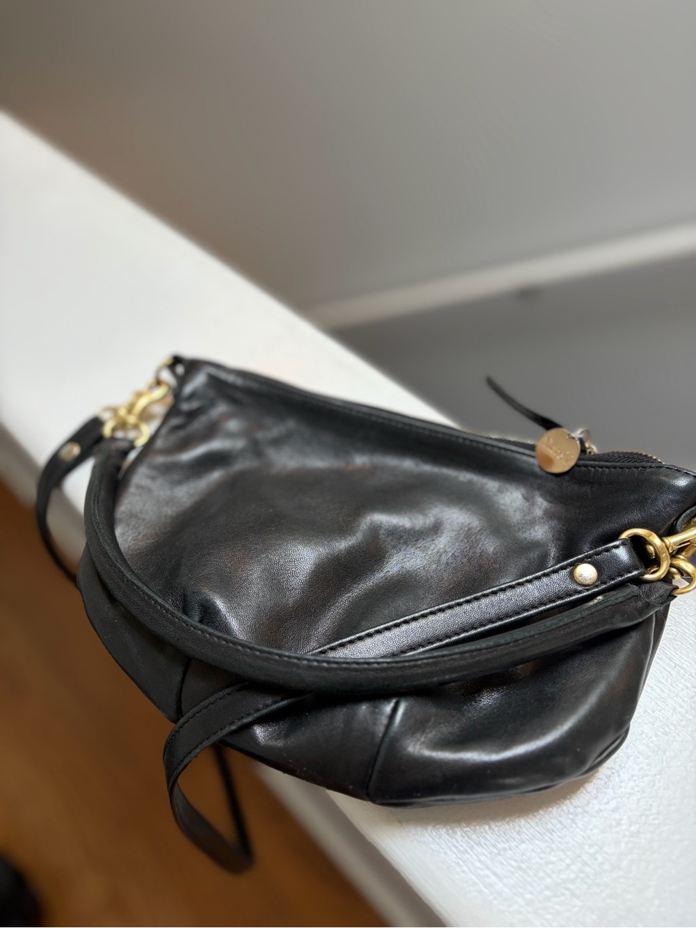 Classic Black Leather Crossbody with Gold Accents